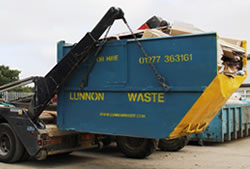 Skip Hire Essex unloading a full skip