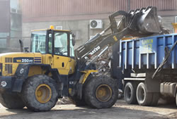 Skip Hire Essex loading a lorry for transfer