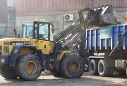 Skip Hire Essex loading a lorry